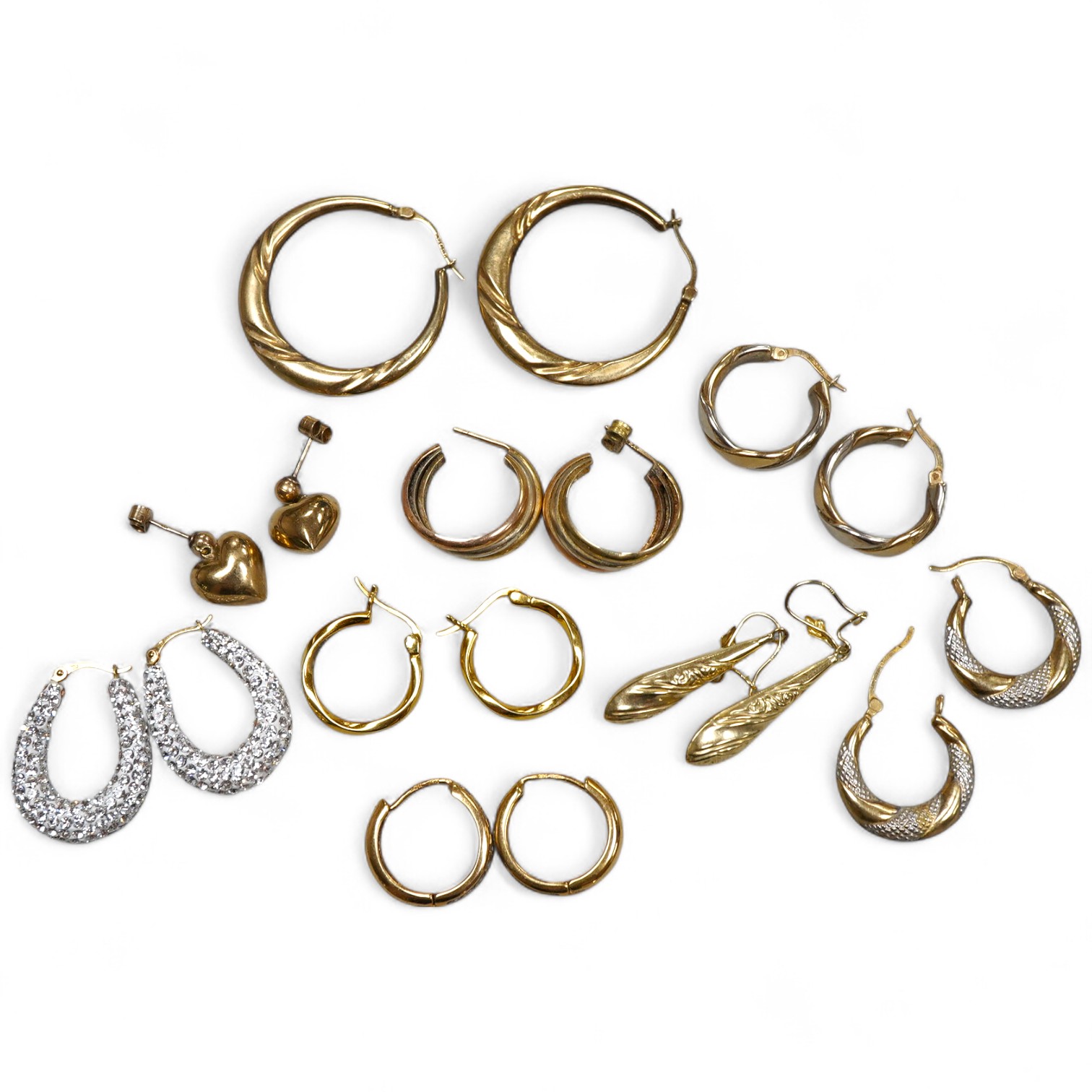 Nine pairs of earrings, comprising: seven hoop earrings, two of which set with pastes; and two pairs of drop earrings, six with British hallmarks for 9ct gold combined gross weight approximately 18 grams, three variously